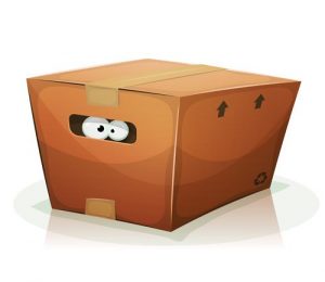 Un par de ojos de dibujos animados en la trampa de cartón marrón